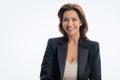 Portrait of brunette haired woman wearing black suit and cheerful smiling against isolated white background Royalty Free Stock Photo