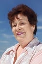 Portrait of brunette pensioner woman smiling