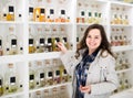 Portrait of brunette shopping in perfume store