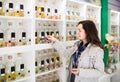 Portrait of brunette shopping in perfume store