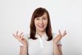 Portrait of brunette surprised happy woman in blank red t-shirt with copy space on white background. Mock up. Menopause