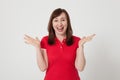 Portrait of brunette surprised happy woman in blank red t-shirt with copy space on white background. Mock up. Menopause
