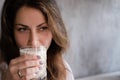 portrait of brunette woman girl in loft cafe. coffee break. lunch time. happy worker. business woman relax Royalty Free Stock Photo