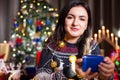 Portrait of brunette woman holding a blue gift box in hands Royalty Free Stock Photo