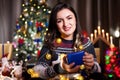 Portrait of brunette woman holding a blue gift box in hands Royalty Free Stock Photo