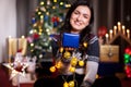 Portrait of brunette woman holding a blue gift box in hands Royalty Free Stock Photo