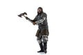 Portrait of brutal brave man in costume of medieval warrior, knight posing isolated over white studio background Royalty Free Stock Photo