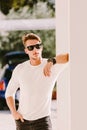 Portrait of a brutal man in sunglasses and watch outdoors Royalty Free Stock Photo