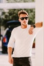 Portrait of a brutal man in sunglasses and watch outdoors Royalty Free Stock Photo