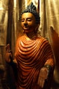 Portrait of the Buddha in full . Colored statue on