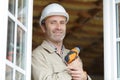 portrait builder holding drill by double glazed windows Royalty Free Stock Photo