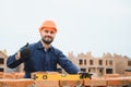 Portrait of a builder in the process of working on a construction site outdoors Royalty Free Stock Photo