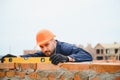 Portrait of a builder in the process of working on a construction site outdoors Royalty Free Stock Photo