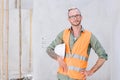 portrait builder professional engineer architect foreman hipster worker work in construction site, looking camera confident Royalty Free Stock Photo