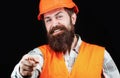 Portrait of a builder smiling. Bearded man worker with beard in building helmet or hard hat. Man builders, industry Royalty Free Stock Photo