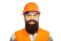 Portrait of a builder smiling. Builder in hard hat, foreman or repairman in the helmet. Bearded man worker with beard in Royalty Free Stock Photo