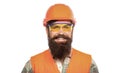 Portrait of a builder smiling. Builder in hard hat, foreman or repairman in the helmet. Bearded man worker with beard in Royalty Free Stock Photo