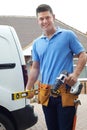 Portrait Of Builder With Van Outside House Royalty Free Stock Photo