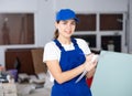 Portrait of builder woman who checks completed work on