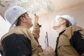 Portrait builders inspecting roof damage Royalty Free Stock Photo