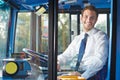 Portrait Of Bus Driver Behind Wheel Royalty Free Stock Photo