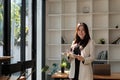 Portrait of business asian woman happy smile holding check list on clipboard and pen at modern offlice Royalty Free Stock Photo