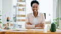 Portrait, business and black woman with crossed arms and smile for fashion designer, professional and positive mindset