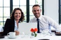 Portrait of business colleagues using a laptop while having a meeting Royalty Free Stock Photo