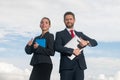 Portrait of business couple in suit with thumbs up. Two young business workers working together with laptop. Secretary Royalty Free Stock Photo