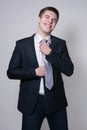 Portrait of a business man adjusting his tie Royalty Free Stock Photo