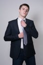 Portrait of a business man adjusting his tie Royalty Free Stock Photo