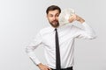 Portrait of a business man holding money, isolated on white. Royalty Free Stock Photo