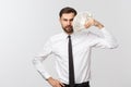 Portrait of a business man holding money, isolated on white. Royalty Free Stock Photo