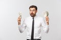 Portrait of a business man holding money, isolated on white. Royalty Free Stock Photo