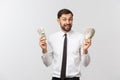 Portrait of a business man holding money, isolated on white. Royalty Free Stock Photo