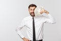 Portrait of a business man holding money, isolated on white. Royalty Free Stock Photo