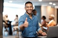 Portrait, business and man with a laptop, thumbs up and internet connection in a modern office, smile and agreement Royalty Free Stock Photo