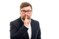 Portrait of business man making silence gesture Royalty Free Stock Photo