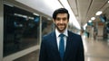 Portrait of business man smile at camera while standing at station. Exultant. Royalty Free Stock Photo