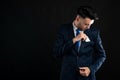 Portrait of business man wearing blue business suit and tie take out the card pocket Royalty Free Stock Photo