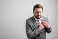 Portrait of business man wearing business clothes with his hand on his chest suffering from acute pain