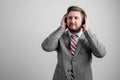 Portrait of business man wearing business clothes listen good music Royalty Free Stock Photo