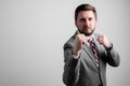 Portrait of business man wearing business clothes showing fists like fighting Royalty Free Stock Photo