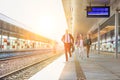 Portrait of business people running to catch the train in station Royalty Free Stock Photo