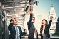 Portrait of Business team raising arms celebrate and Throw money on blurred city background. Business success concept. Vintange Royalty Free Stock Photo