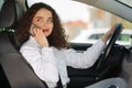 Portrait of business woman driver talking her mobile phone while driving car Royalty Free Stock Photo