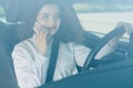 Portrait of business woman driver talking her mobile phone while driving car Royalty Free Stock Photo