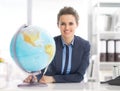 Portrait of business woman holding earth globe Royalty Free Stock Photo