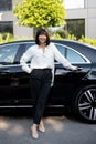 Portrait of business woman near a luxury car outdoors Royalty Free Stock Photo