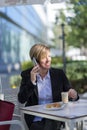 Portrait of a business woman sitting relaxed at outdoor cafe Royalty Free Stock Photo